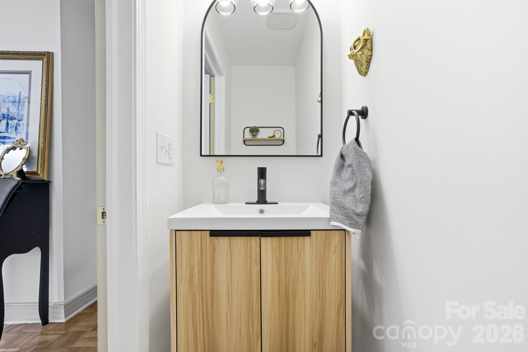 6046 Windjammer Drive Tega Cay, SC 29708 - Photo 21 of 46 a bathroom with a sink and a mirror