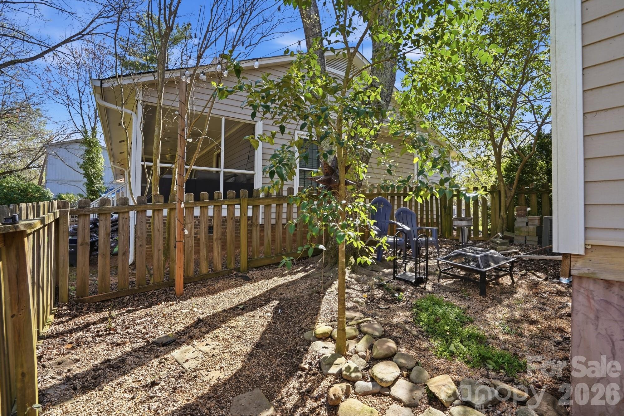6046 Windjammer Drive Tega Cay, SC 29708 - Photo 43 of 46 a view of a pathway of a house with a bench