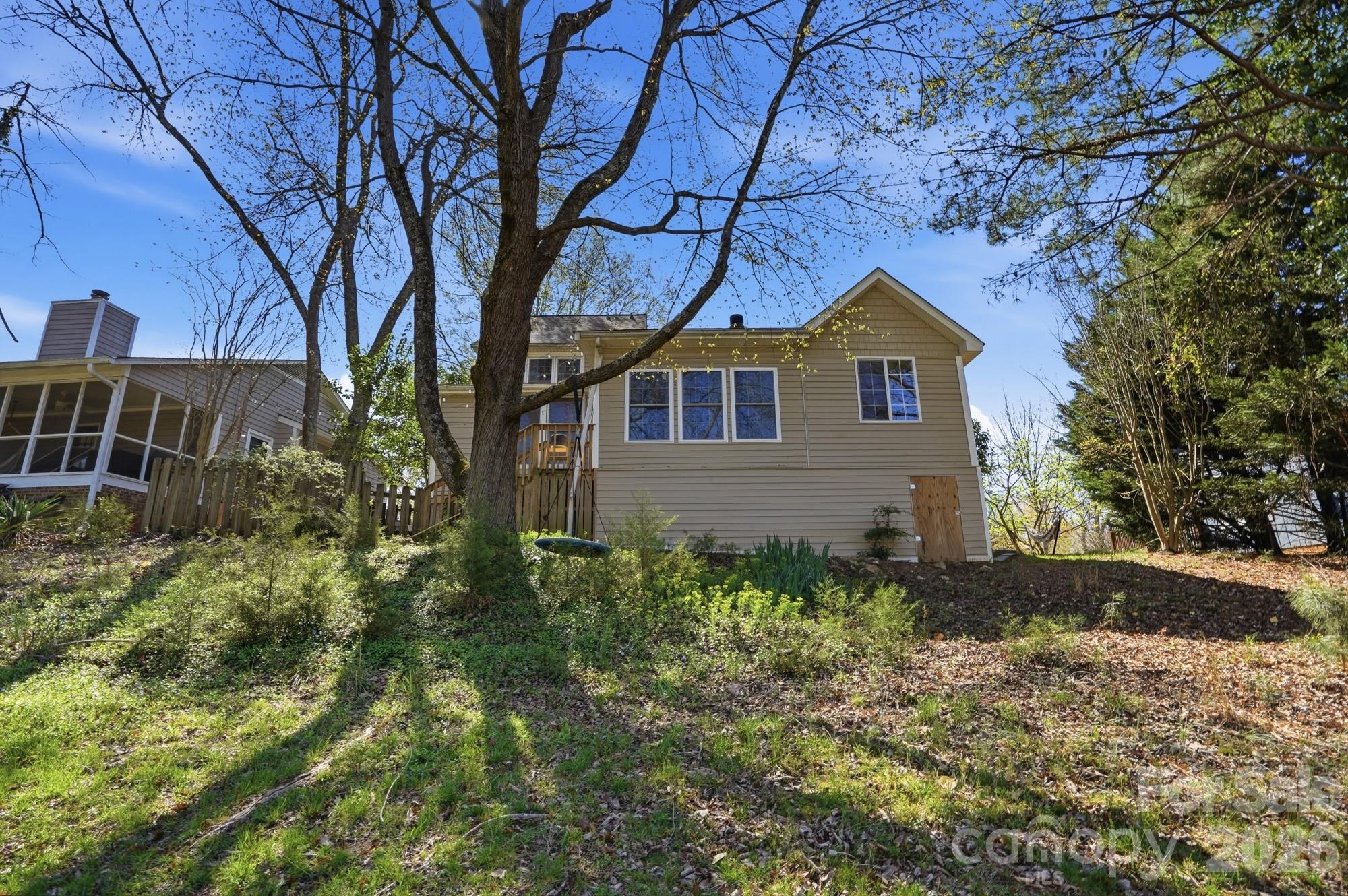6046 Windjammer Drive Tega Cay, SC 29708 - Photo 45 of 46 a house view with a garden space
