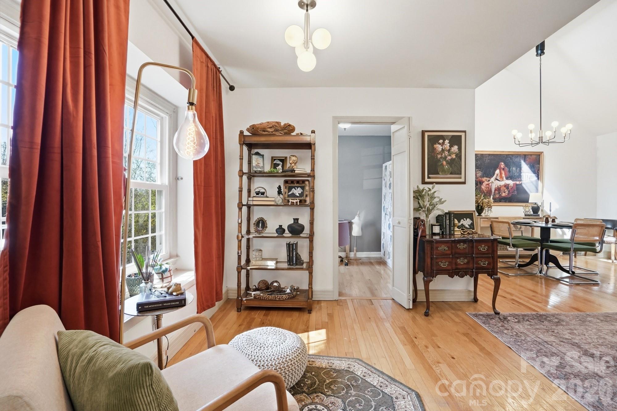 6046 Windjammer Drive Tega Cay, SC 29708 - Photo 5 of 46 a living room with furniture a dining table and a window