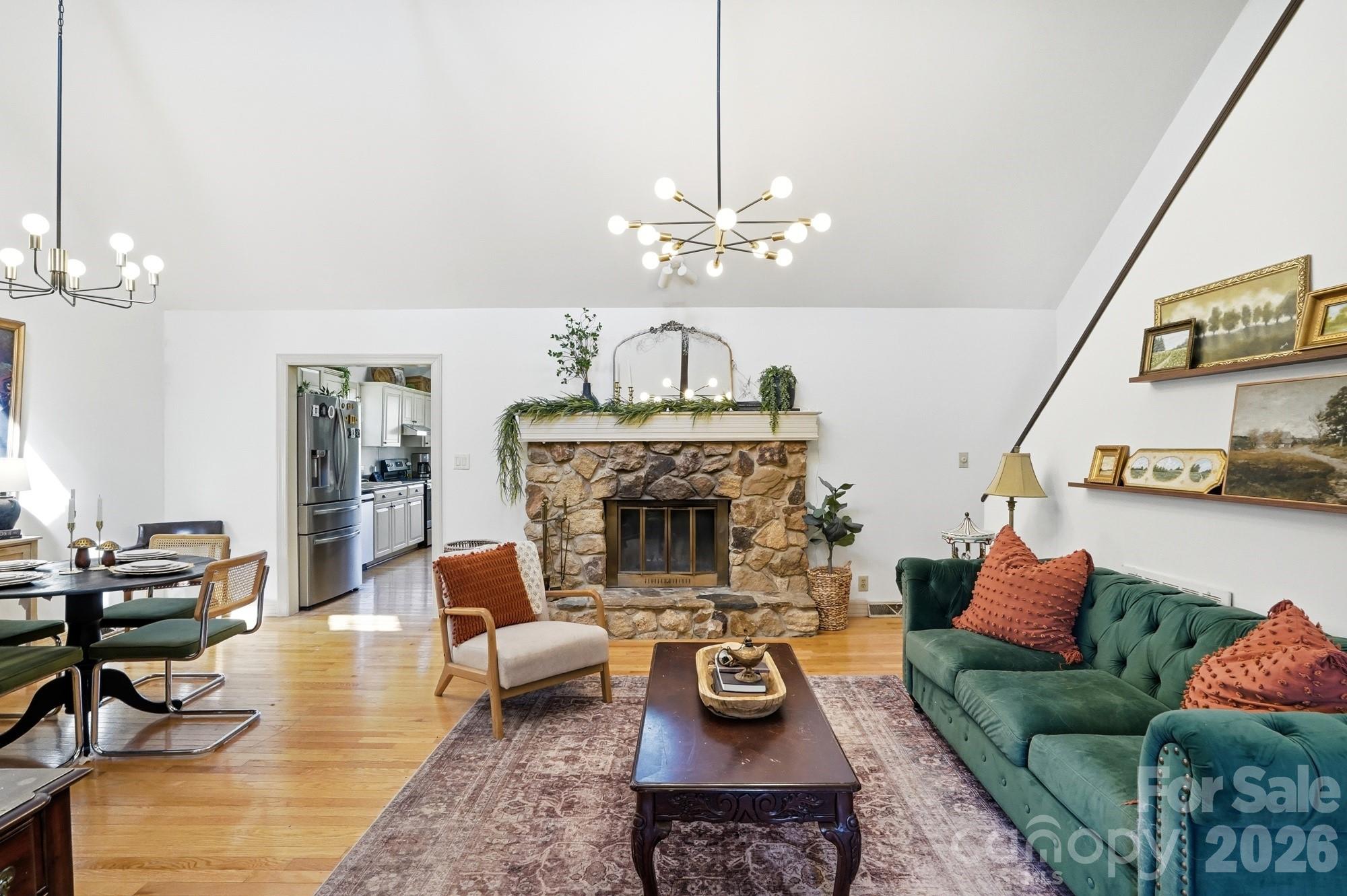 6046 Windjammer Drive Tega Cay, SC 29708 - Photo 7 of 46 a living room with furniture and a fireplace