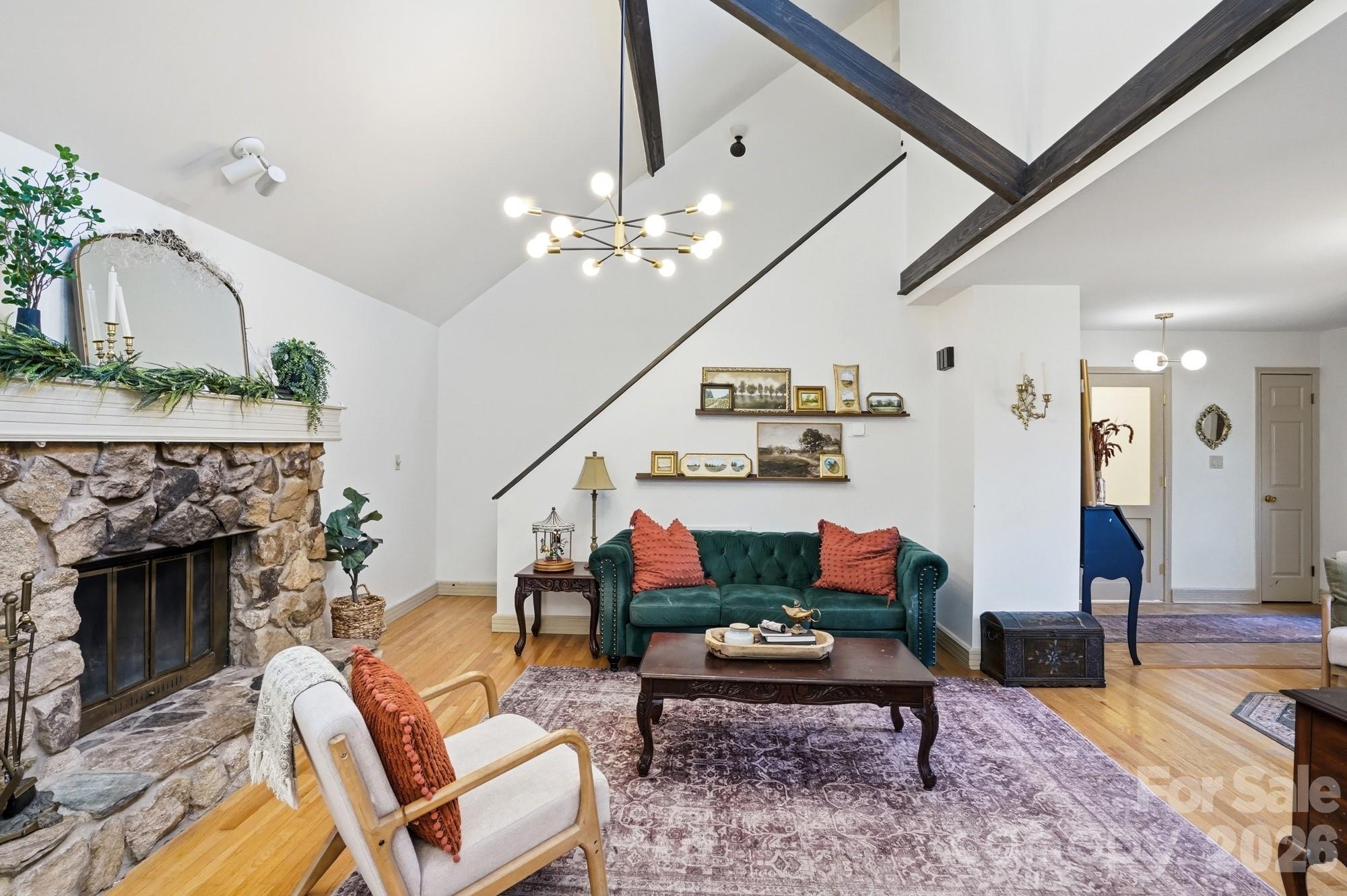 6046 Windjammer Drive Tega Cay, SC 29708 - Photo 9 of 46 a living room with furniture and a fireplace