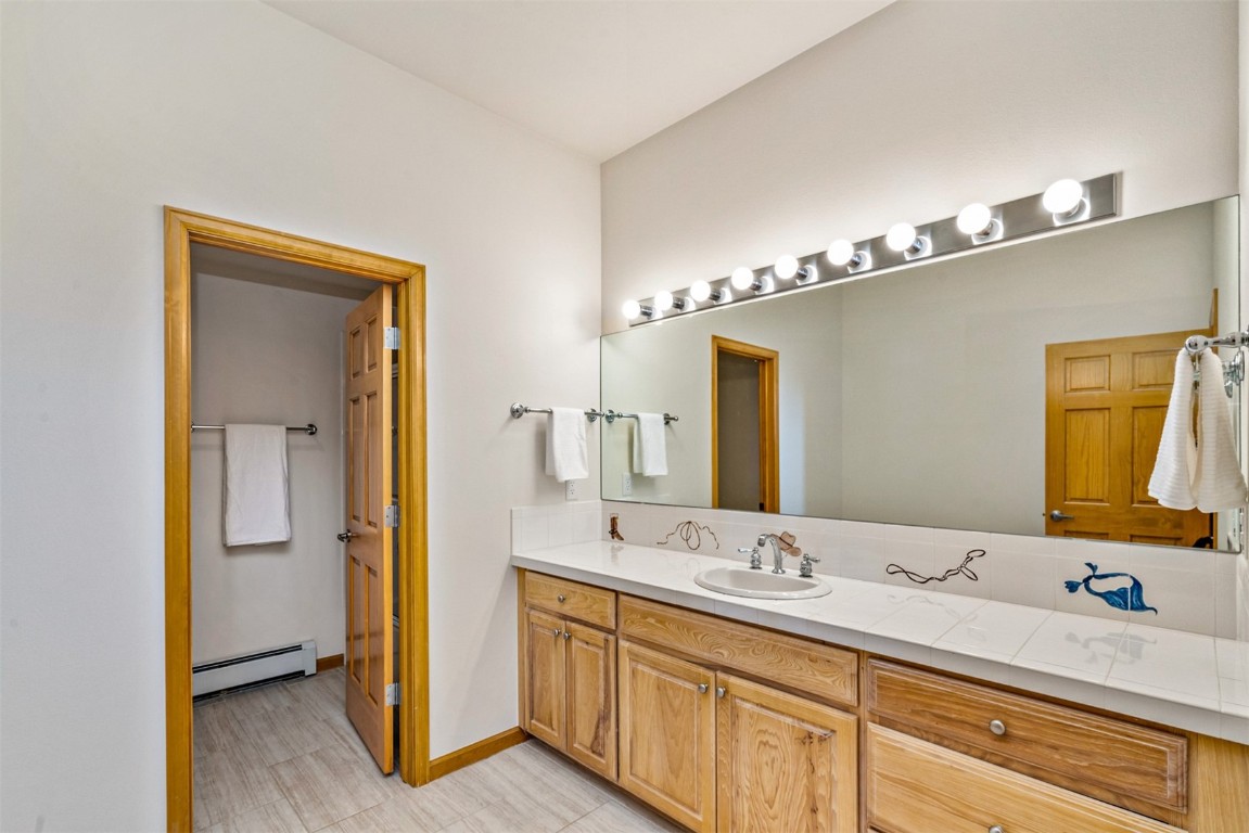 40 Nordic Trail Silverthorne, CO 80498 - Photo 15 of 35 a bathroom with a double vanity sink and a mirror