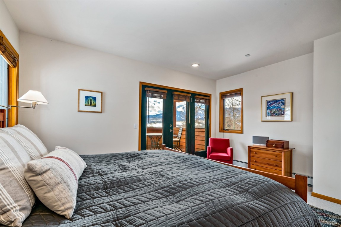 40 Nordic Trail Silverthorne, CO 80498 - Photo 18 of 35 a bedroom with a bed and wooden floor