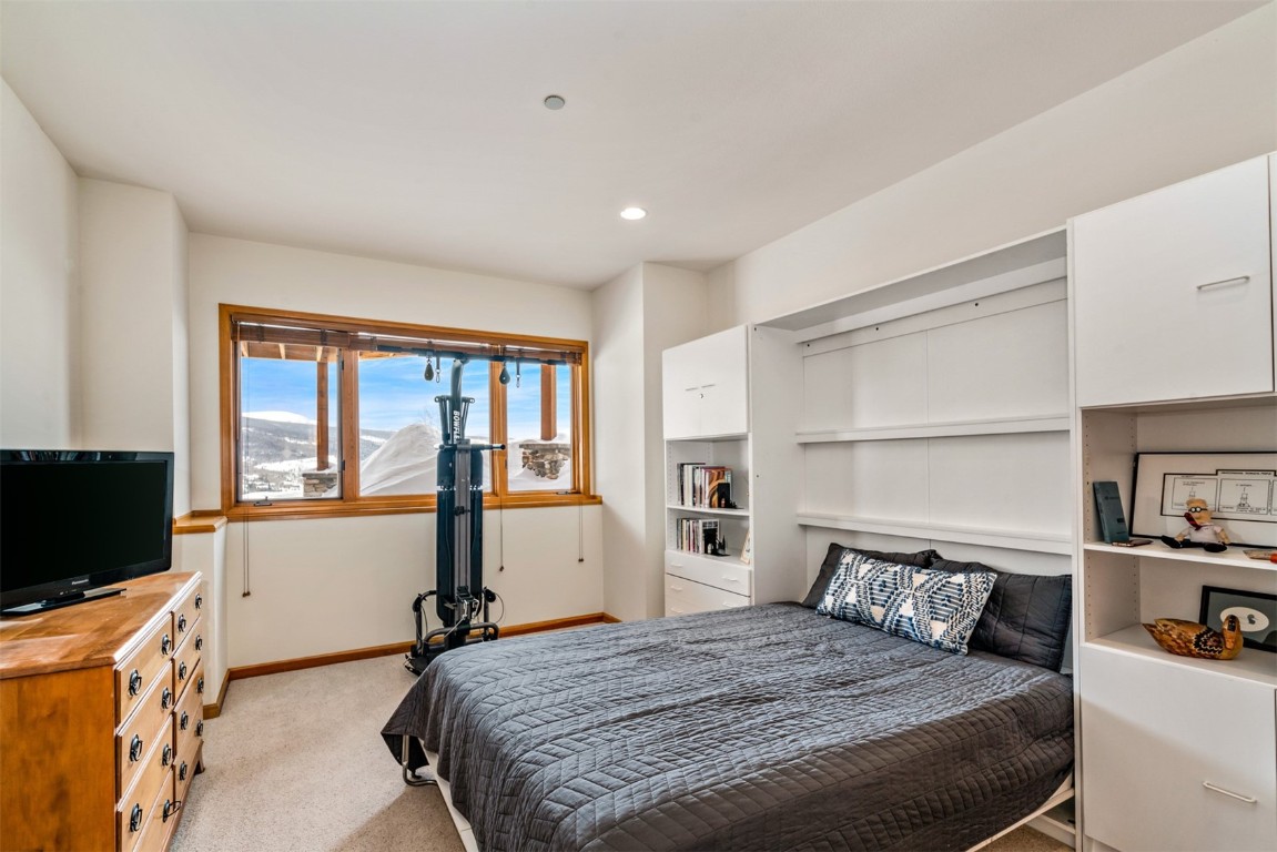 40 Nordic Trail Silverthorne, CO 80498 - Photo 29 of 35 a bedroom with a bed and a flat screen television