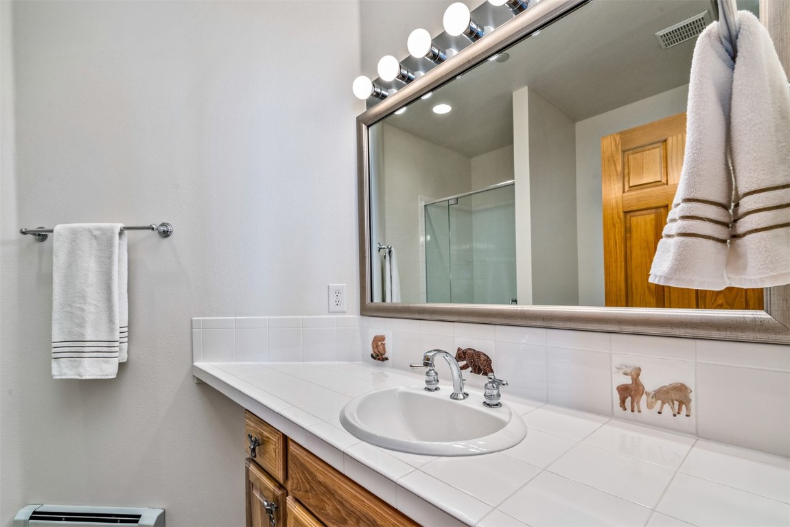 40 Nordic Trail Silverthorne, CO 80498 - Photo 31 of 35 a bathroom with a sink and a mirror