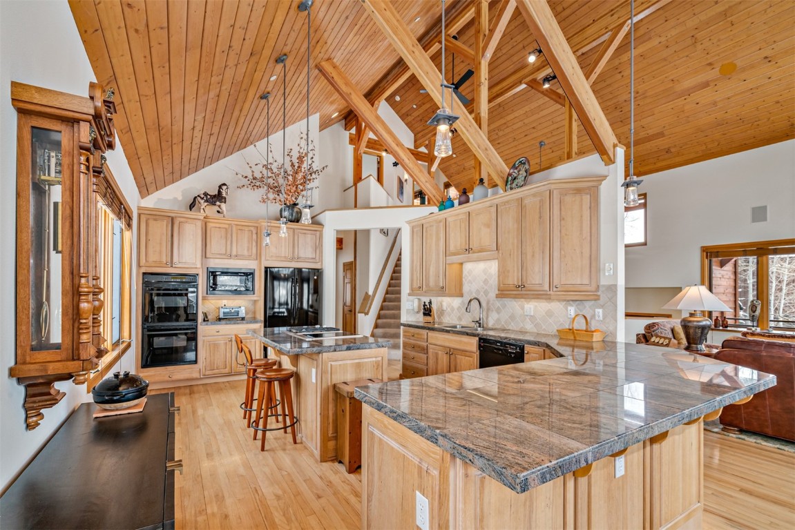 40 Nordic Trail Silverthorne, CO 80498 - Photo 9 of 35 a kitchen with stainless steel appliances granite countertop a stove and cabinets with wooden floor