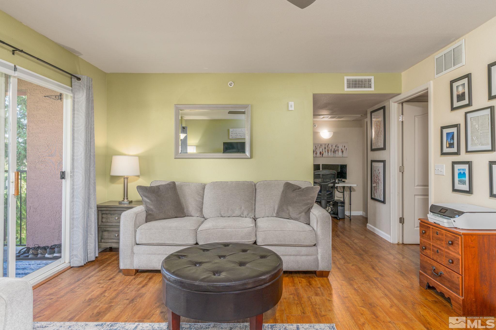6850 Sharlands Avenue, Unit S2106 Reno, NV 89523 - Photo 11 of 36 a living room with furniture and a couch