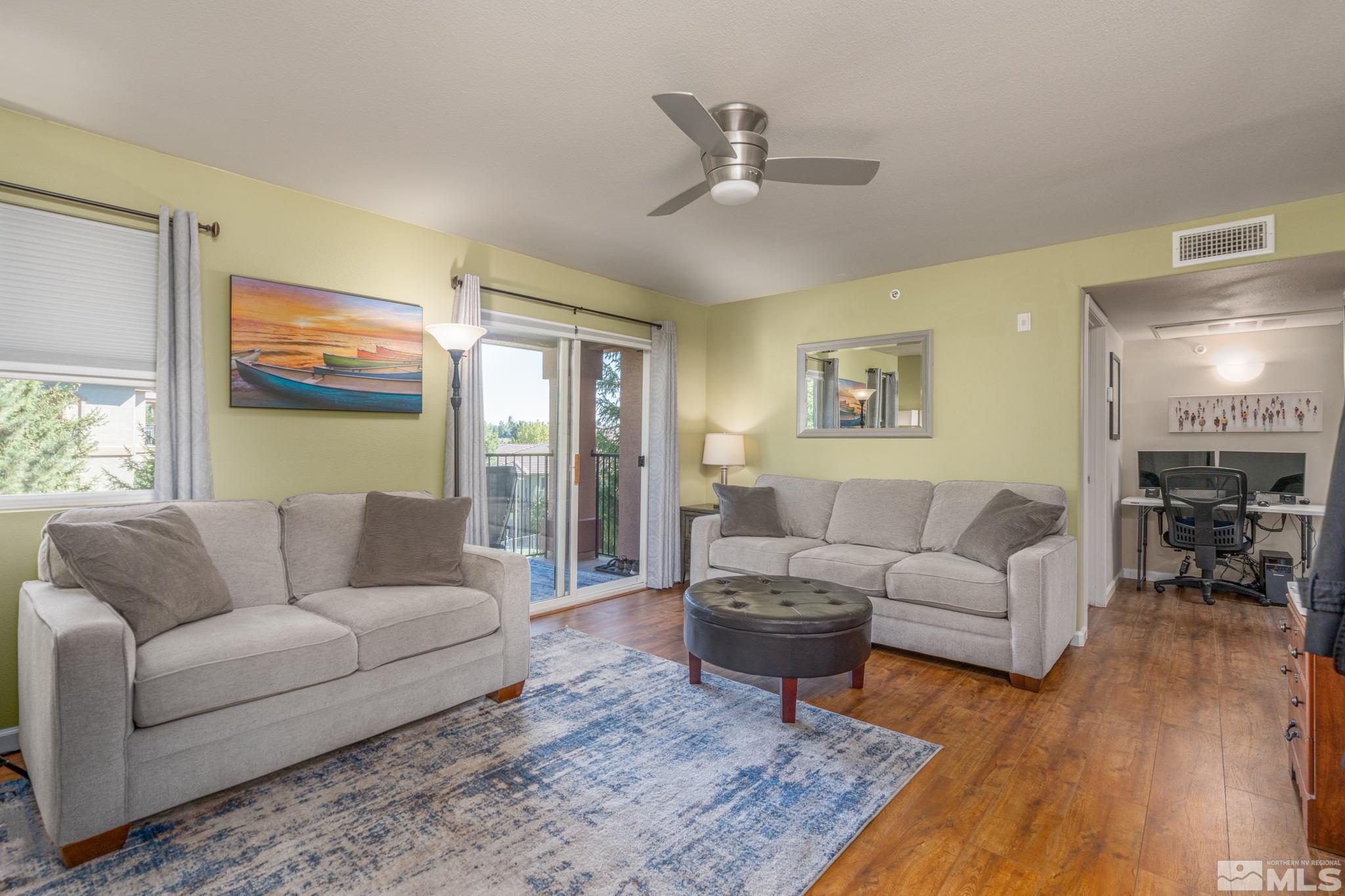 6850 Sharlands Avenue, Unit S2106 Reno, NV 89523 - Photo 12 of 36 a living room with furniture and a large window