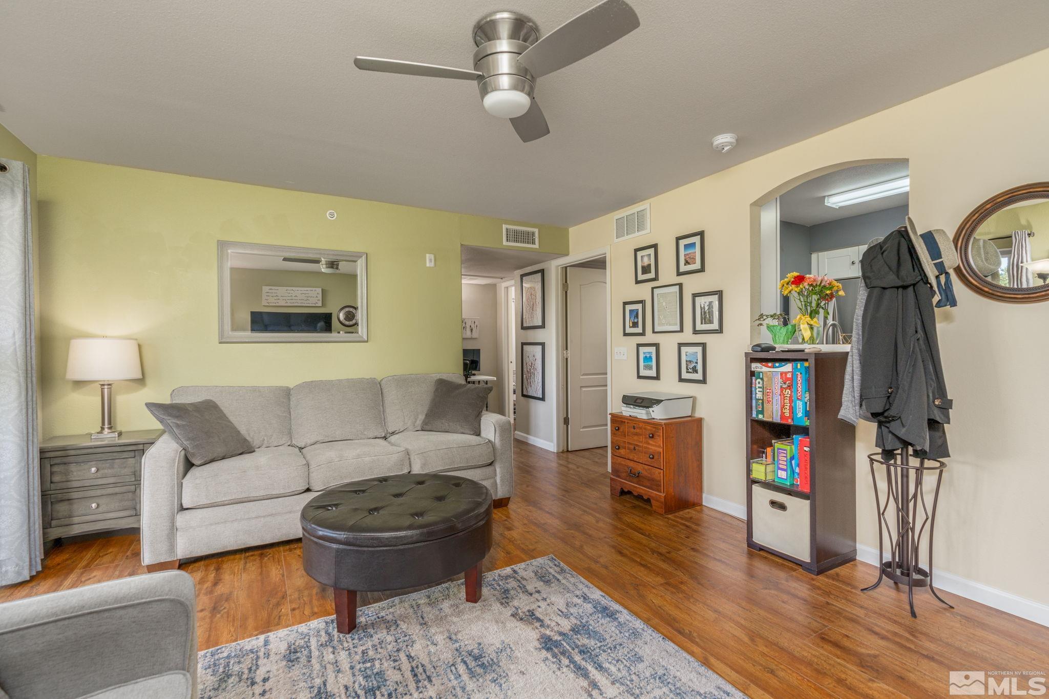 6850 Sharlands Avenue, Unit S2106 Reno, NV 89523 - Photo 13 of 36 a living room with furniture and wooden floor
