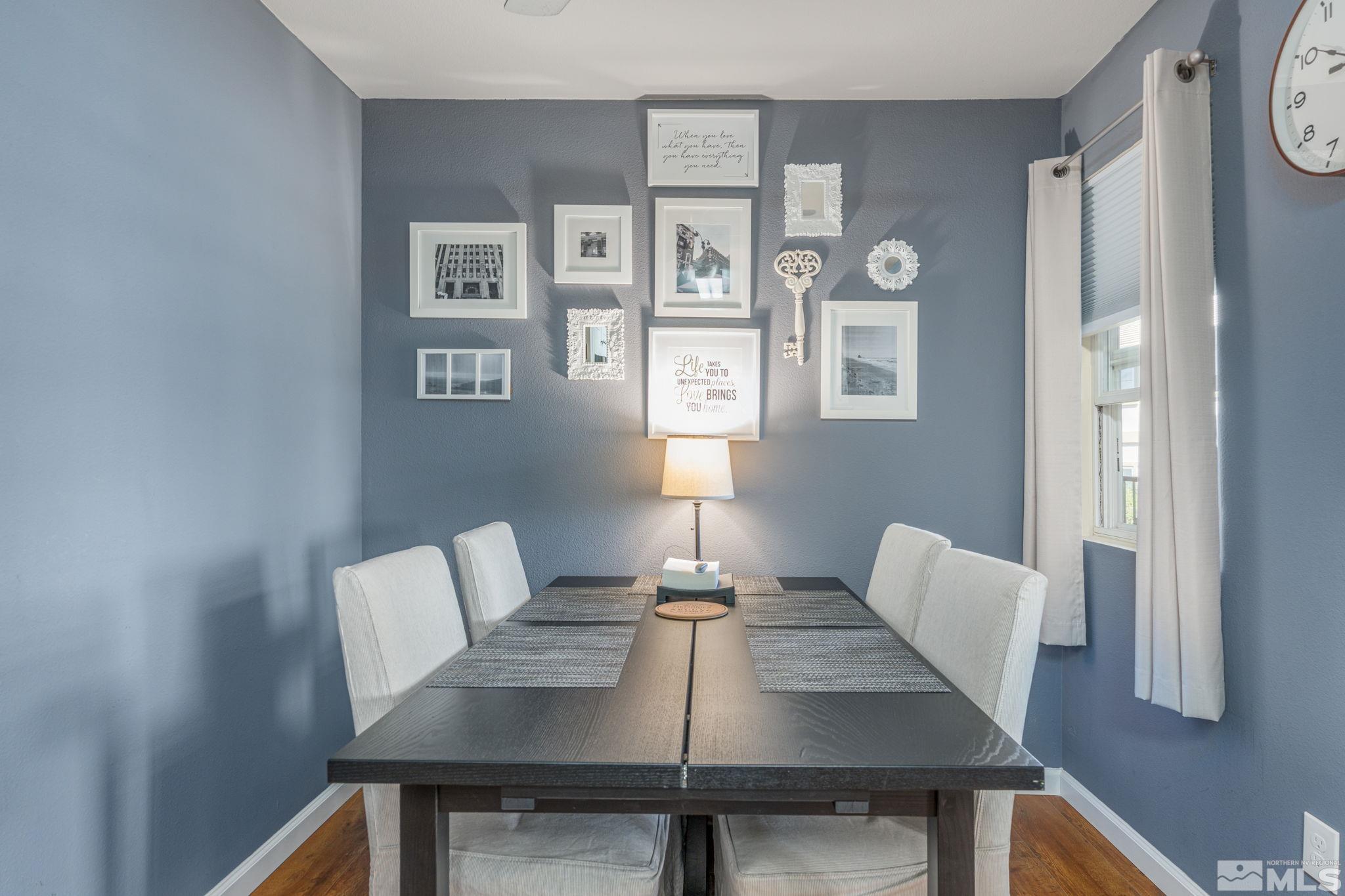6850 Sharlands Avenue, Unit S2106 Reno, NV 89523 - Photo 14 of 36 a view of a dining room with furniture and wooden floor