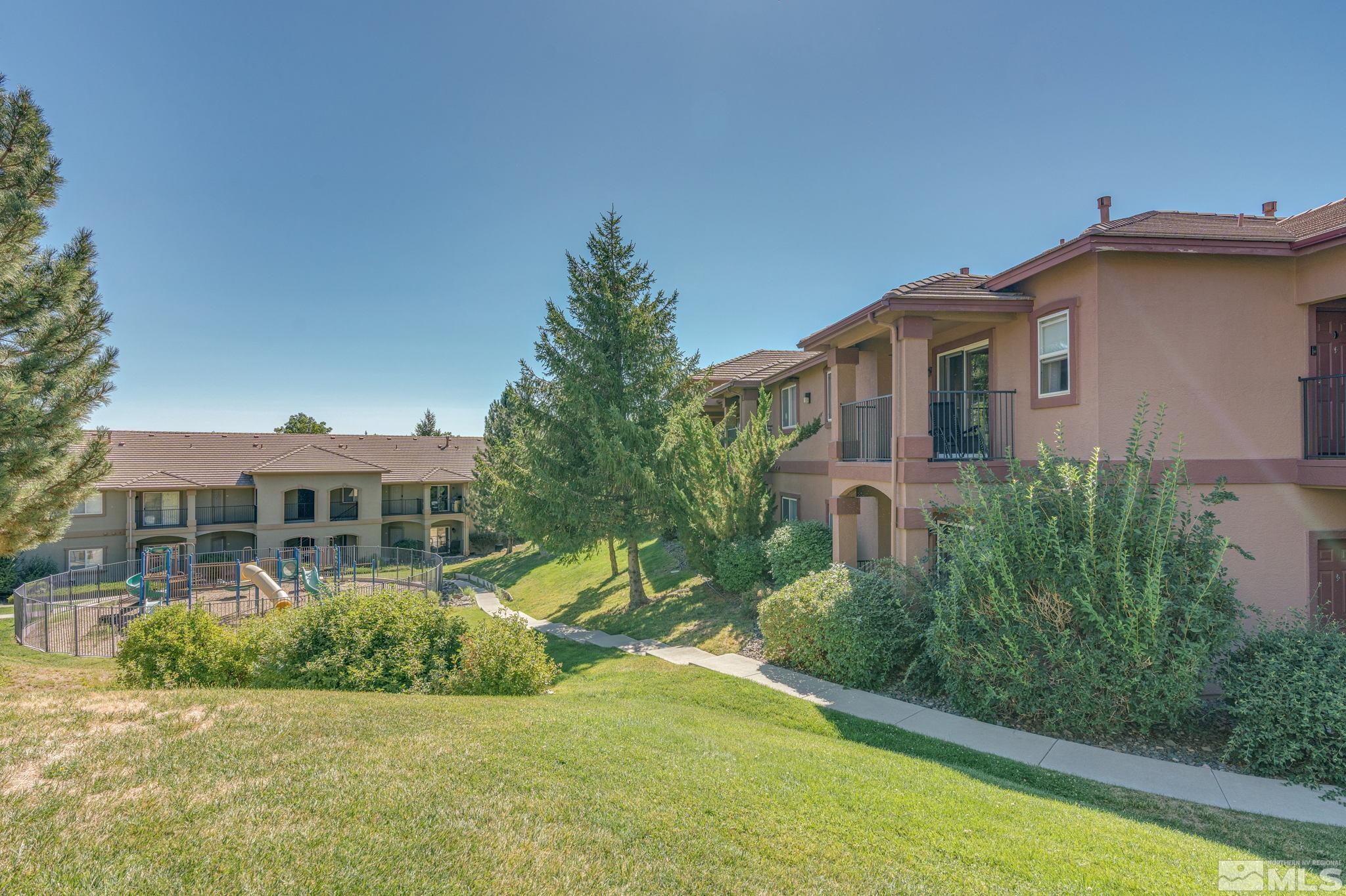 6850 Sharlands Avenue, Unit S2106 Reno, NV 89523 - Photo 21 of 36 a front view of a house with a yard