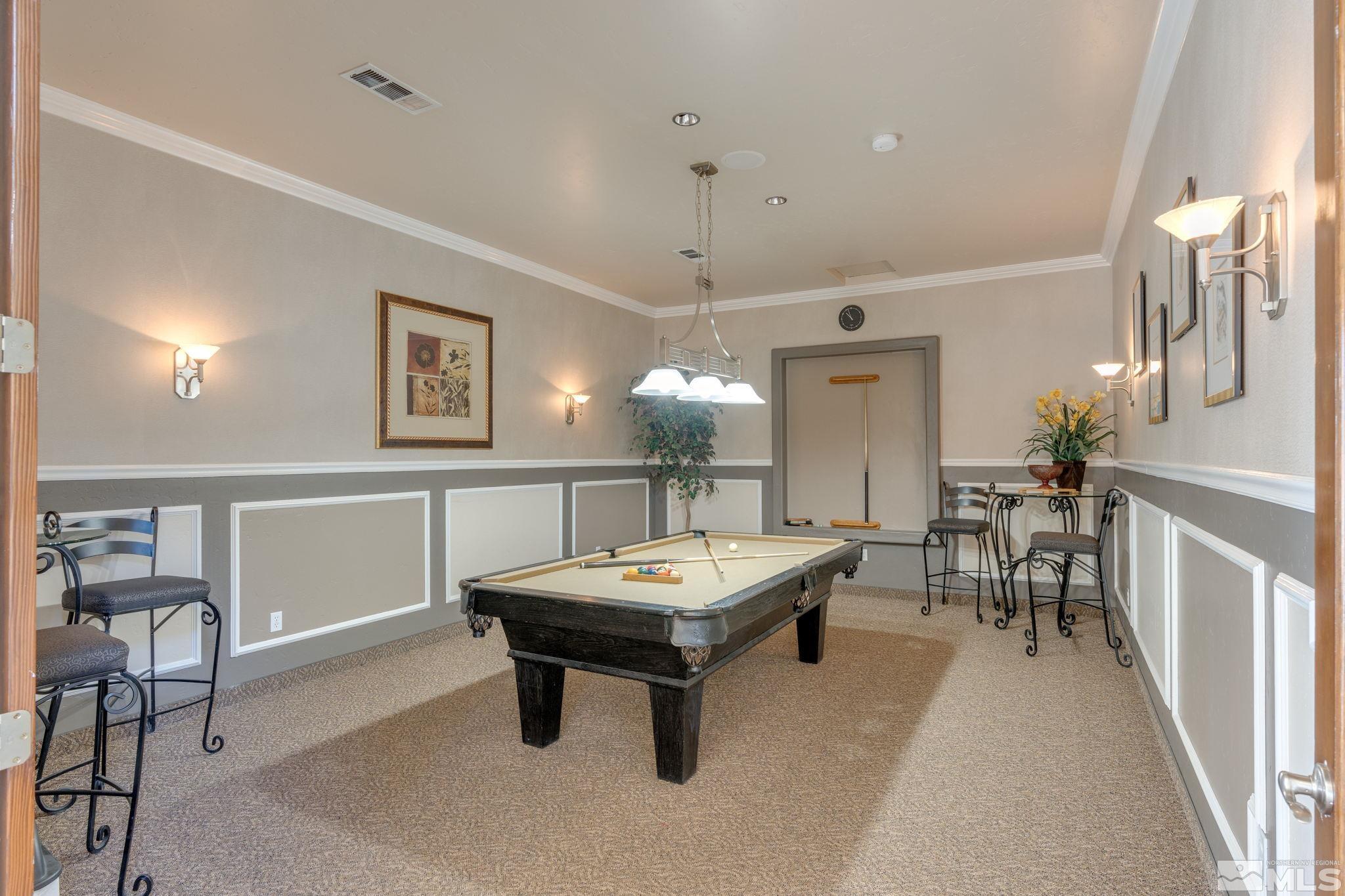6850 Sharlands Avenue, Unit S2106 Reno, NV 89523 - Photo 29 of 36 a living room with furniture a table and chairs