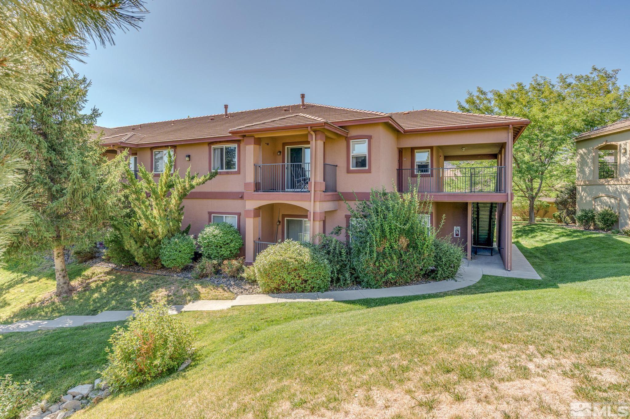 6850 Sharlands Avenue, Unit S2106 Reno, NV 89523 - Photo 3 of 36 a front view of a house with a yard