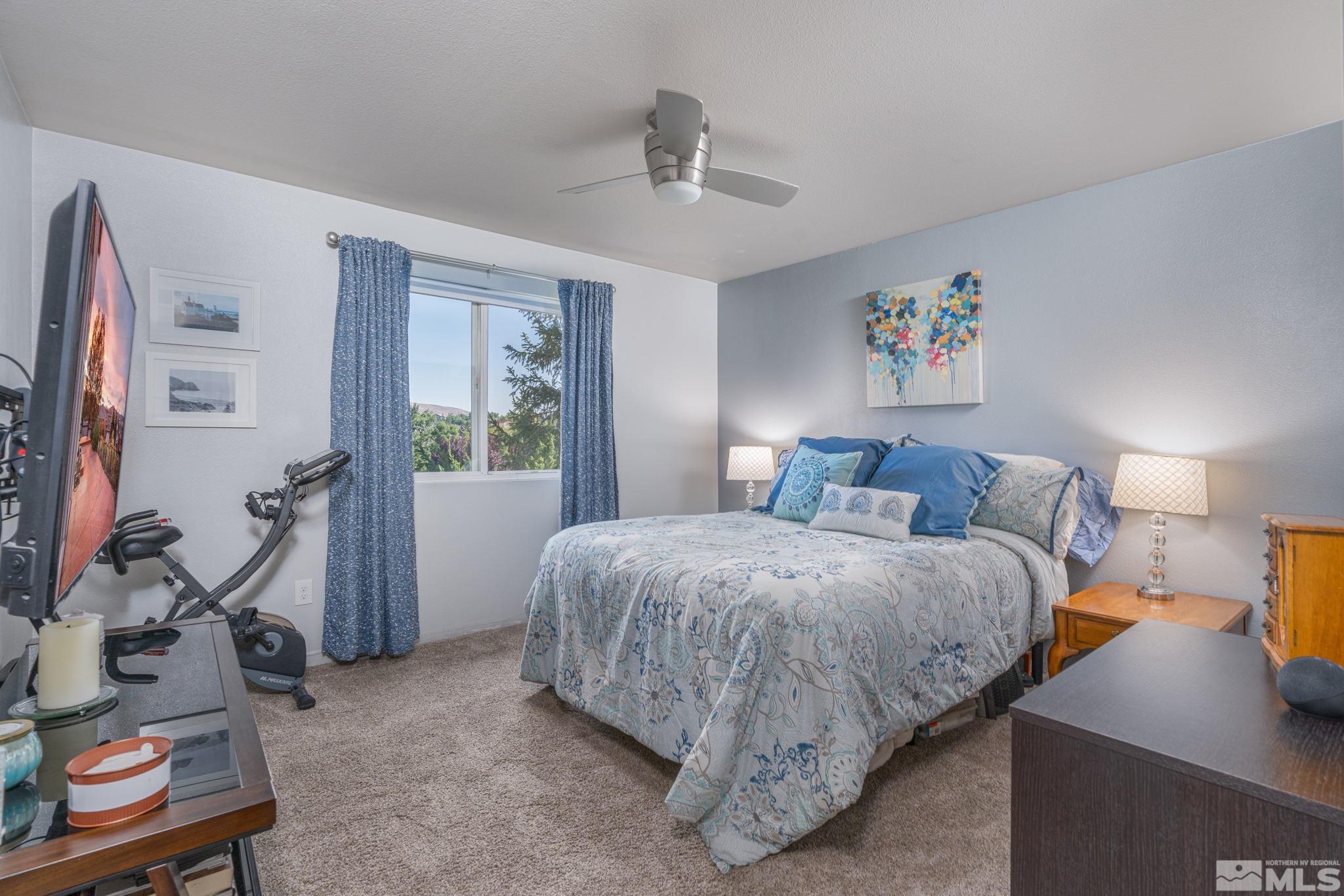 6850 Sharlands Avenue, Unit S2106 Reno, NV 89523 - Photo 4 of 36 a spacious bedroom with a bed and a window