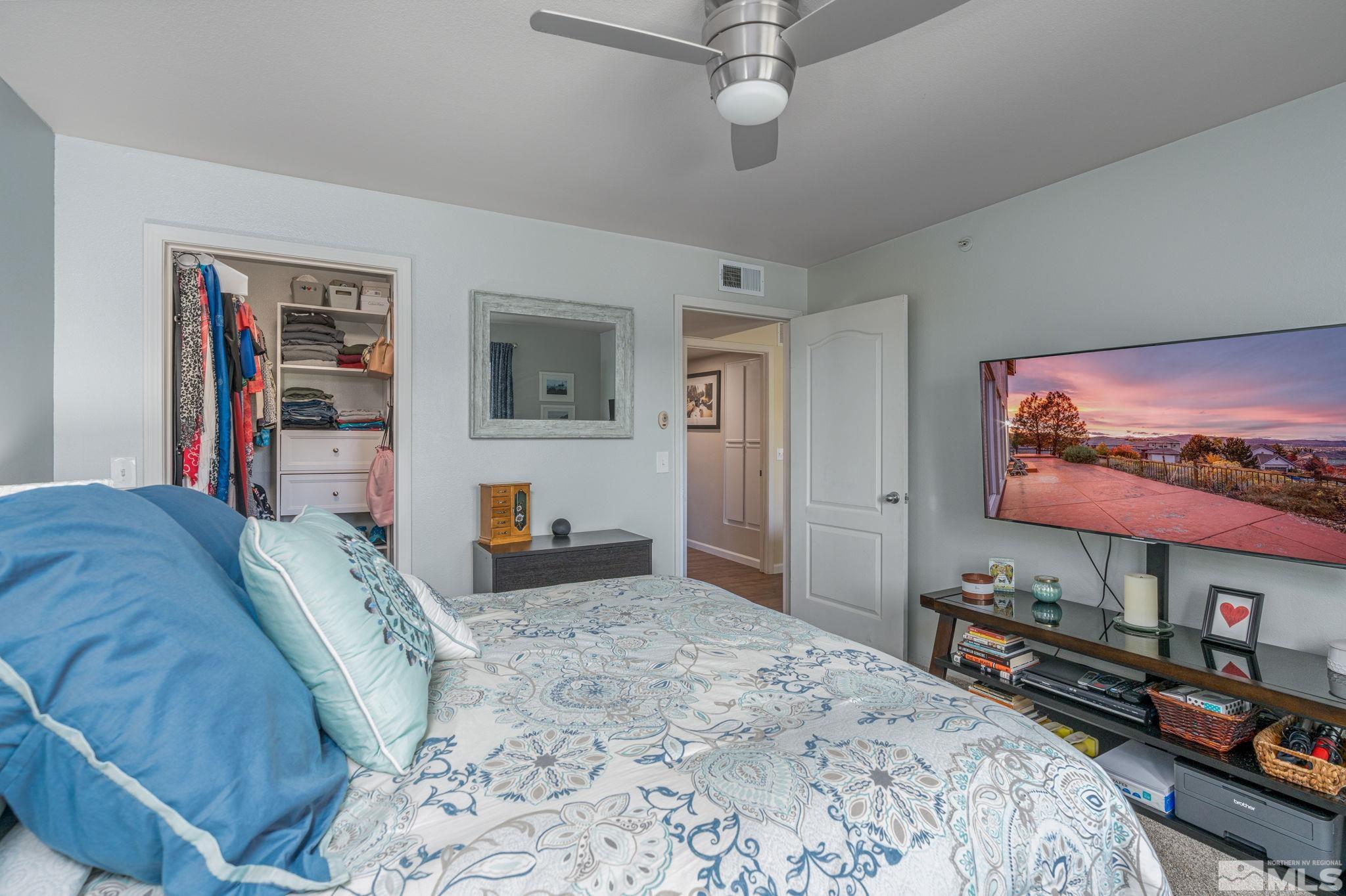 6850 Sharlands Avenue, Unit S2106 Reno, NV 89523 - Photo 5 of 36 a bedroom with bed and tv