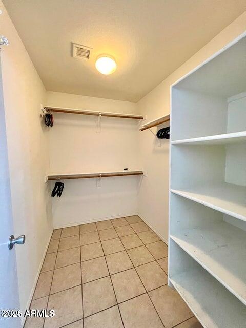 3410 East Escuda Road Phoenix, AZ 85050 - Photo 20 of 43 a view of walk in closet with empty racks