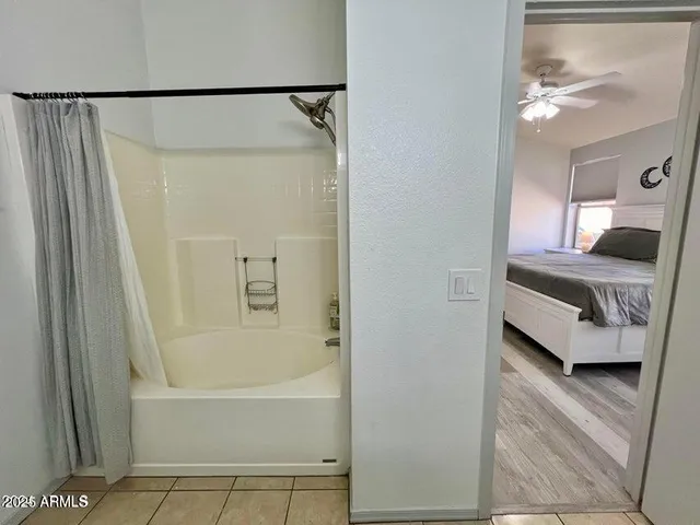 a en suite bathroom with a tub and shower