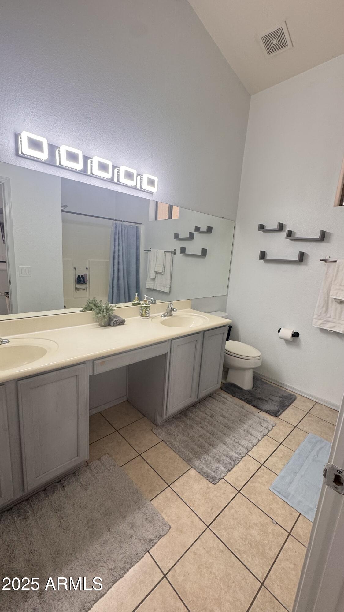 3410 East Escuda Road Phoenix, AZ 85050 - Photo 26 of 43 a bathroom with a double vanity sink and a mirror