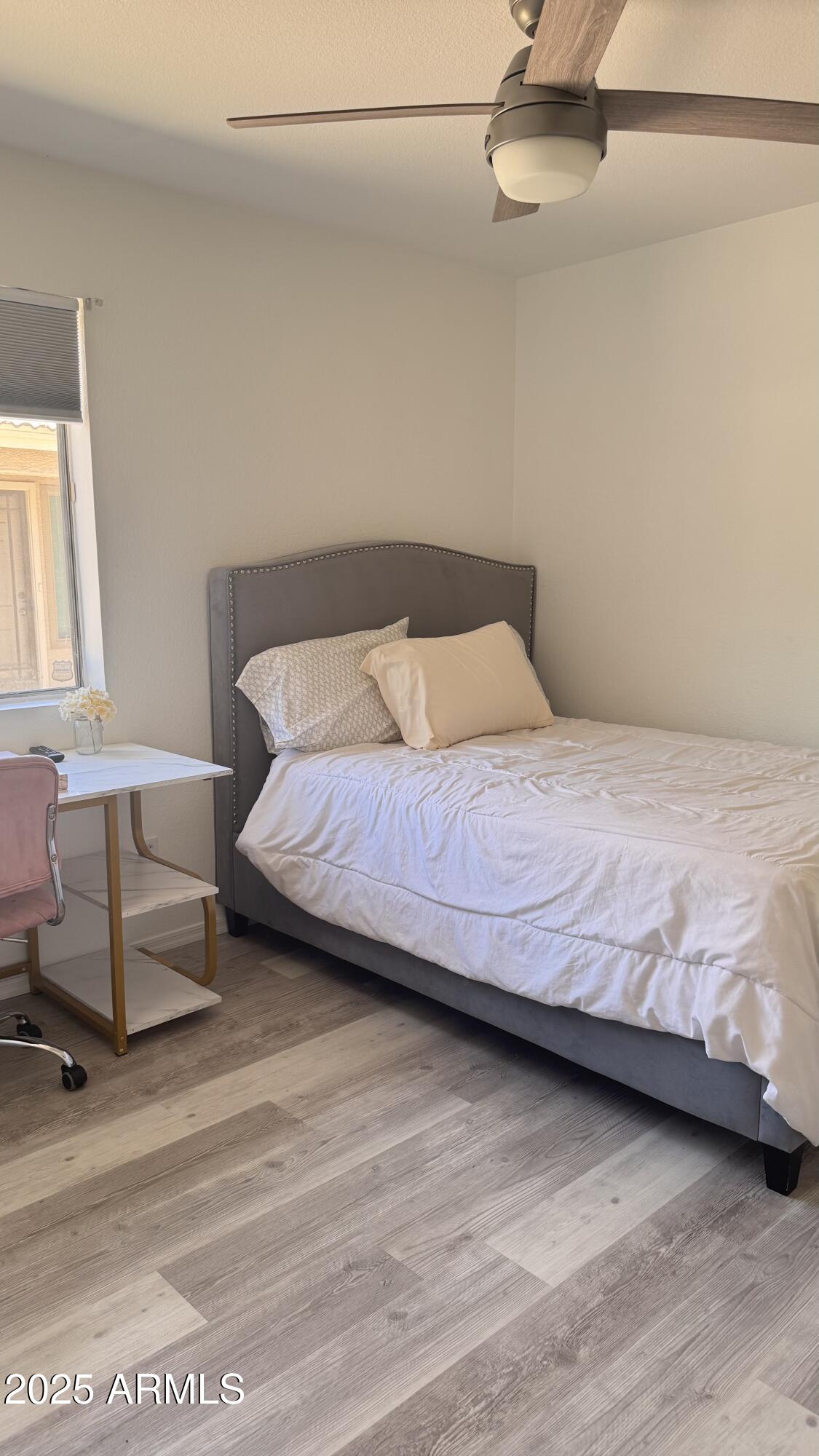 3410 East Escuda Road Phoenix, AZ 85050 - Photo 29 of 43 a bedroom with a bed and a chair