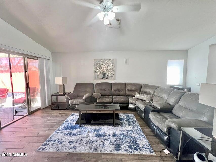 3410 East Escuda Road Phoenix, AZ 85050 - Photo 3 of 43 a living room with furniture and a rug