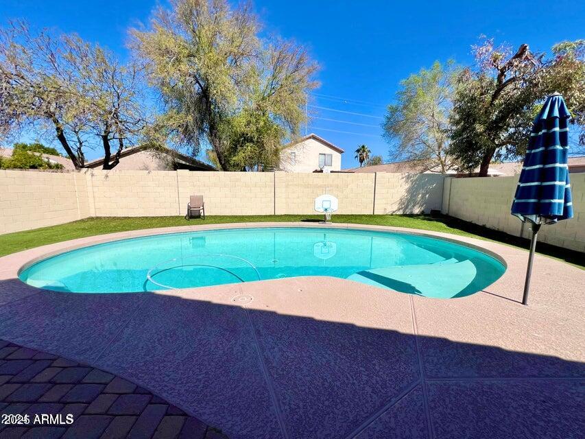 3410 East Escuda Road Phoenix, AZ 85050 - Photo 31 of 43 a view of a backyard with a small pool