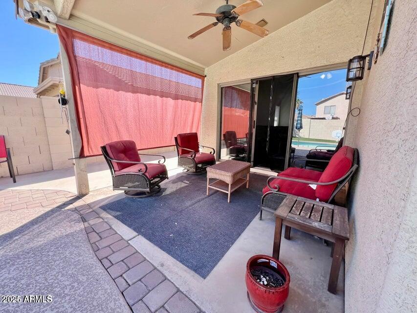 3410 East Escuda Road Phoenix, AZ 85050 - Photo 38 of 43 a living room with furniture a rug and a window