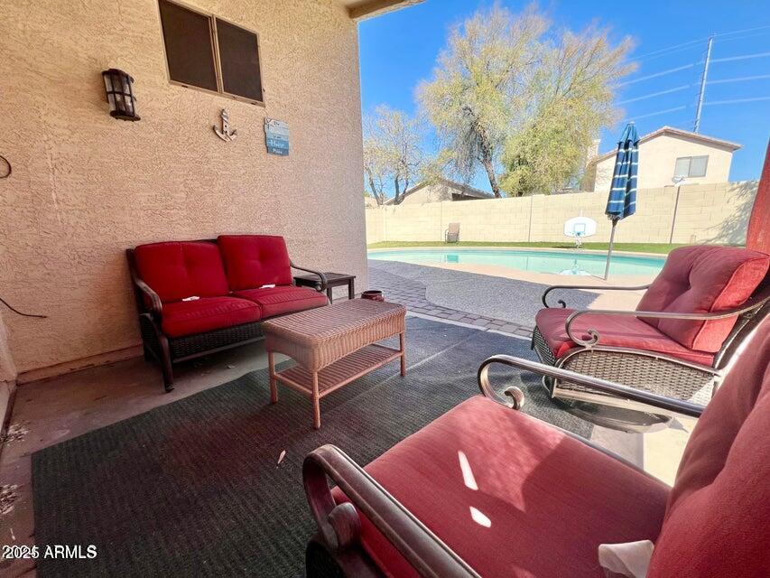 3410 East Escuda Road Phoenix, AZ 85050 - Photo 39 of 43 a living room with furniture and a flat screen tv