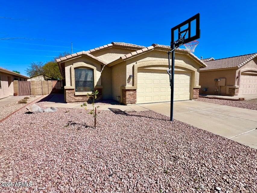 3410 East Escuda Road Phoenix, AZ 85050 - Photo 40 of 43 a view of a house with a yard