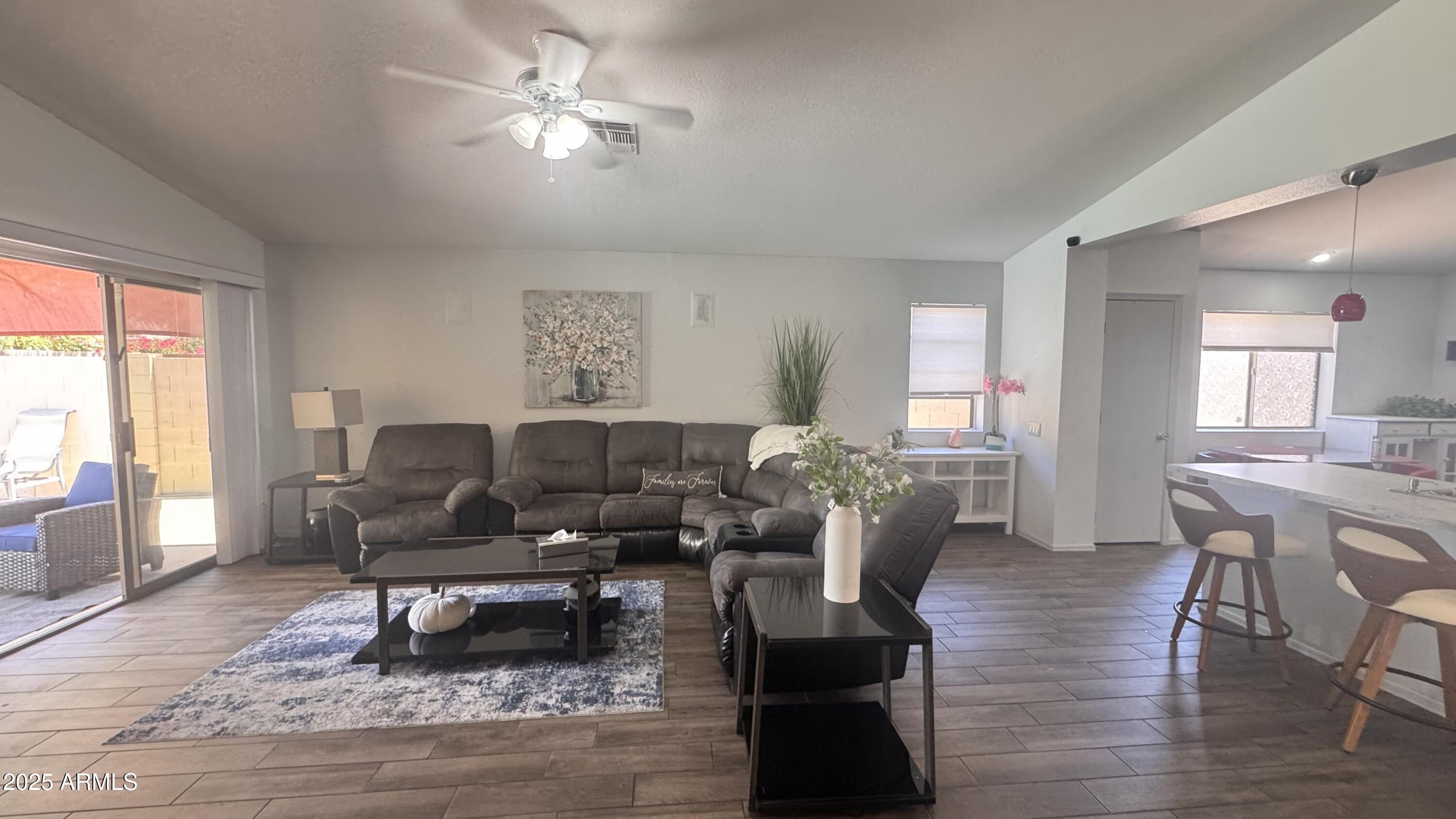 3410 East Escuda Road Phoenix, AZ 85050 - Photo 4 of 43 a living room with furniture a window and a table