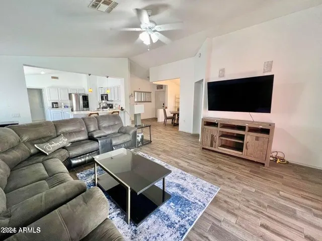 a living room with furniture and a flat screen tv