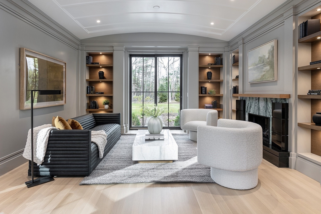 21 Chestnut Street Weston, MA 02493 - Photo 11 of 34 a living room with fireplace furniture and a flat screen tv