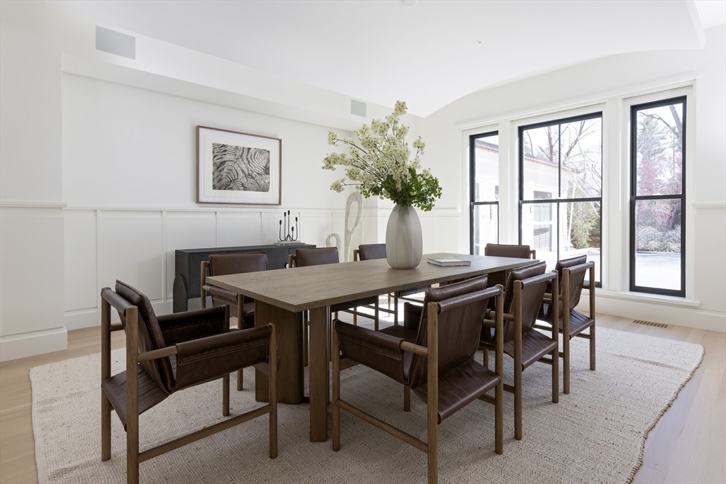 21 Chestnut Street Weston, MA 02493 - Photo 12 of 34 a view of a dining room with furniture and a potted plant