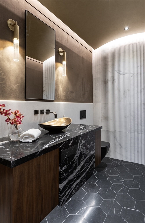 21 Chestnut Street Weston, MA 02493 - Photo 14 of 34 a bathroom with a granite countertop sink a mirror and a