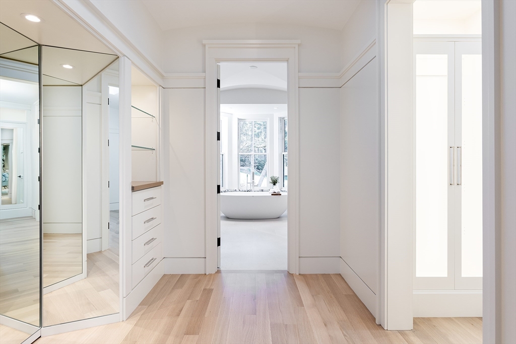 21 Chestnut Street Weston, MA 02493 - Photo 21 of 34 a bathroom with a sink and a glass door shower