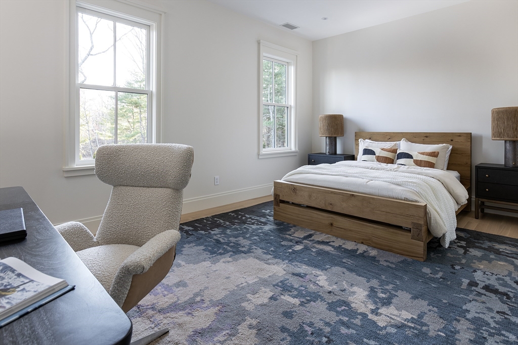 21 Chestnut Street Weston, MA 02493 - Photo 26 of 34 a bedroom with a bed and window