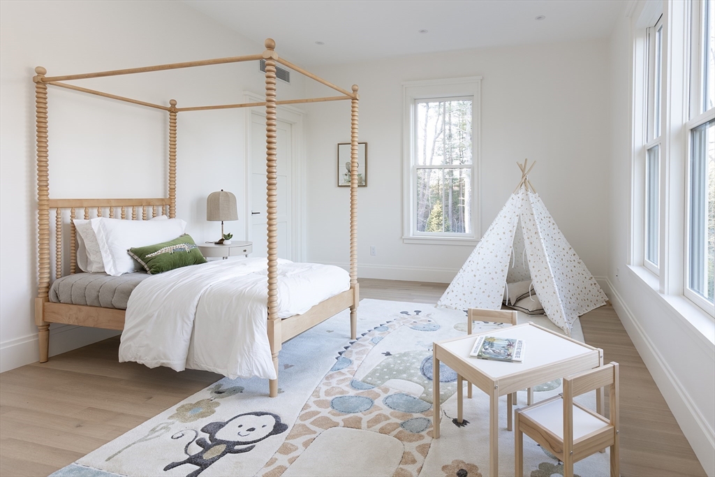 21 Chestnut Street Weston, MA 02493 - Photo 28 of 34 a bed room with a bed and a window