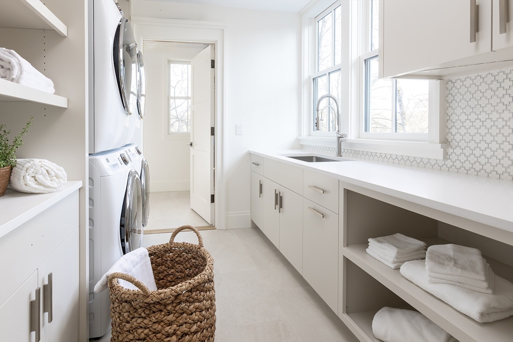 21 Chestnut Street Weston, MA 02493 - Photo 32 of 34 a bathroom with a granite countertop sink and a mirror