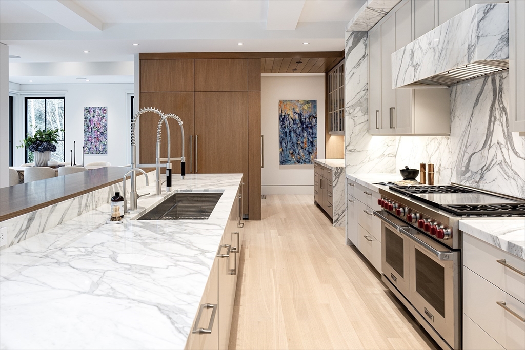 21 Chestnut Street Weston, MA 02493 - Photo 4 of 34 a kitchen with stainless steel appliances a stove a sink and a refrigerator