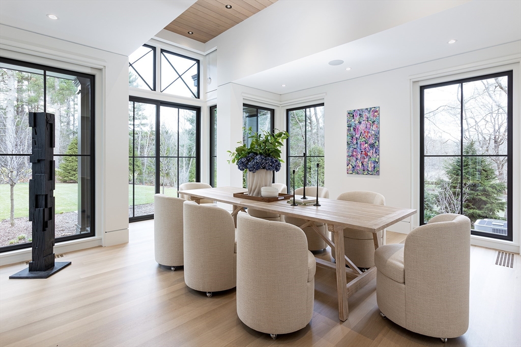 21 Chestnut Street Weston, MA 02493 - Photo 7 of 34 a living room with furniture a large window and wooden floor