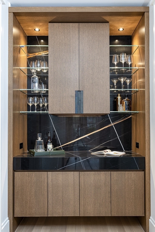 21 Chestnut Street Weston, MA 02493 - Photo 9 of 34 a room with wooden floor and shelf