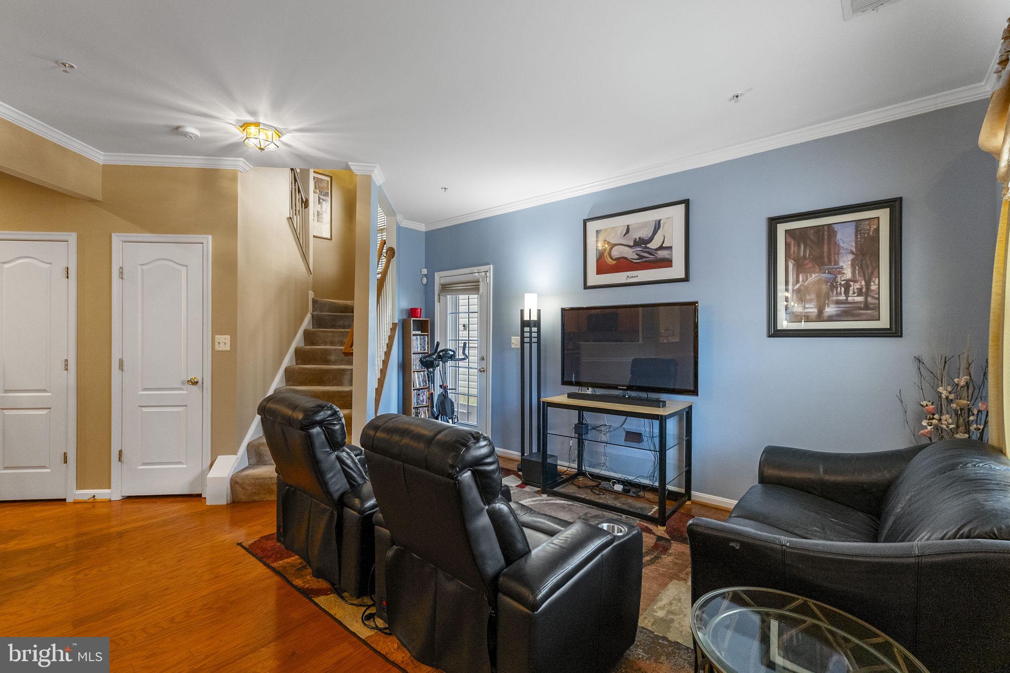 127 Mountain Creek Circle Frederick, MD 21702 - Photo 11 of 26 a living room with furniture and a flat screen tv