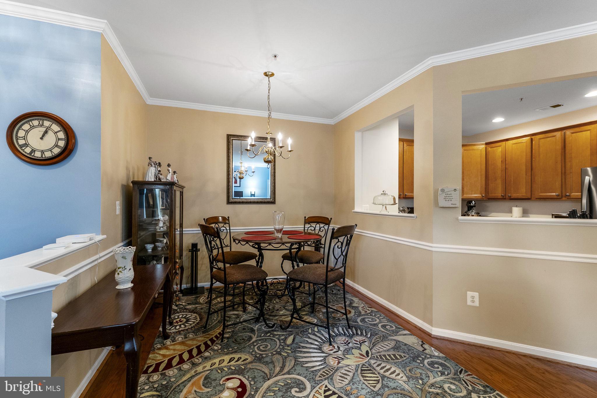 127 Mountain Creek Circle Frederick, MD 21702 - Photo 15 of 26 a view of a dining room with furniture and chandelier