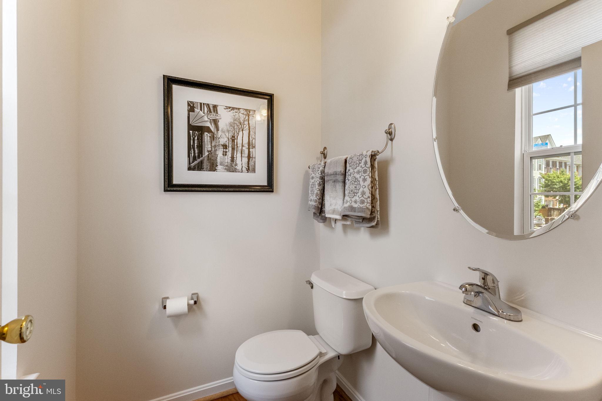 127 Mountain Creek Circle Frederick, MD 21702 - Photo 16 of 26 a bathroom with a toilet a sink and mirror