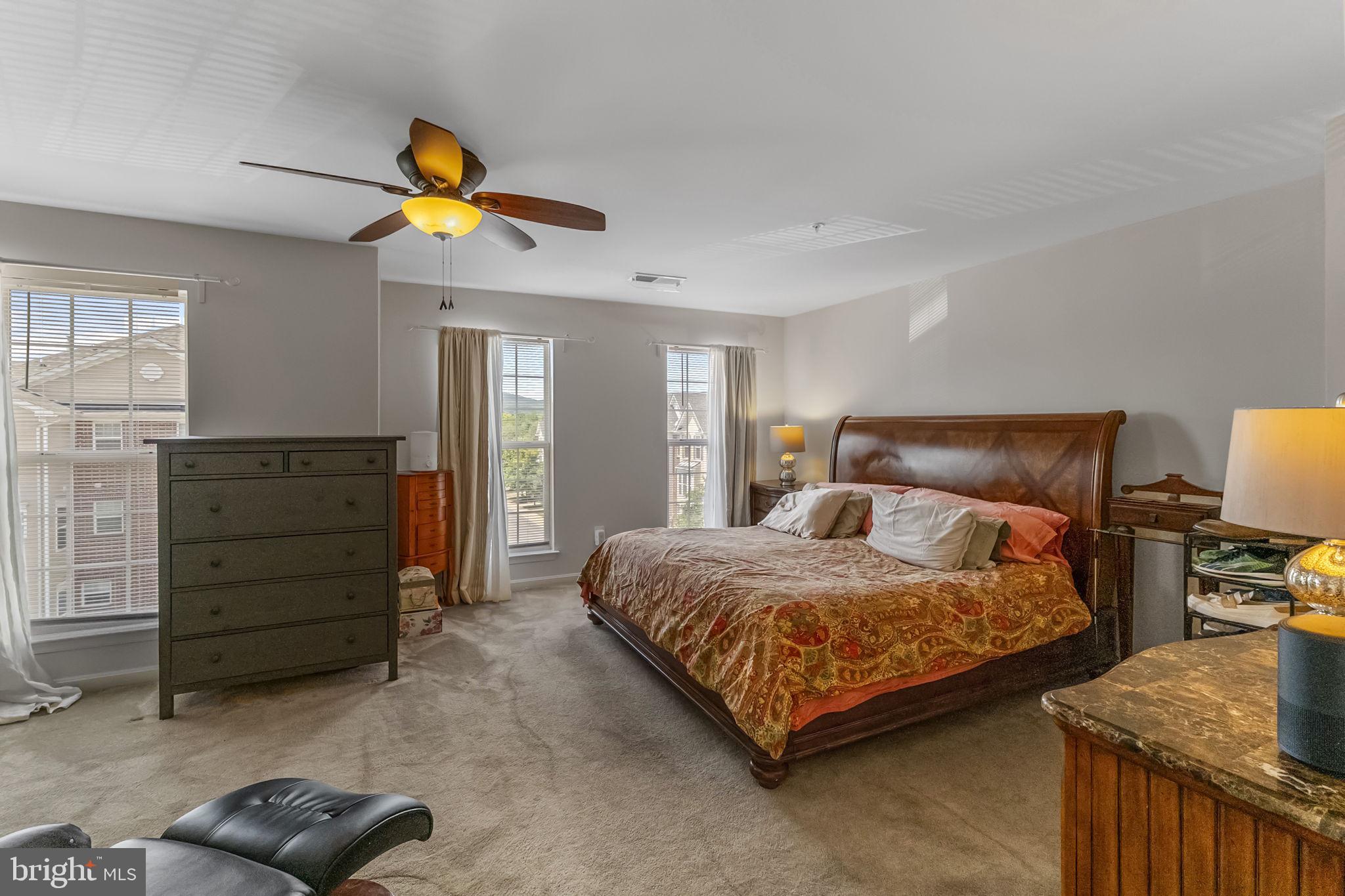 127 Mountain Creek Circle Frederick, MD 21702 - Photo 17 of 26 a bedroom with a bed and cabinets