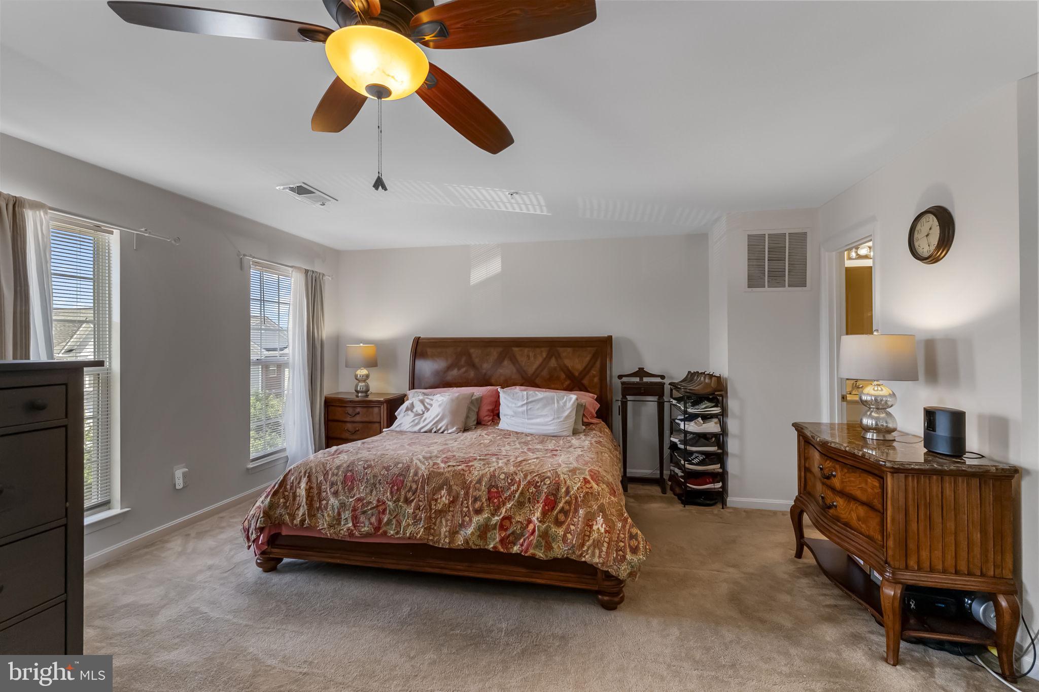 127 Mountain Creek Circle Frederick, MD 21702 - Photo 18 of 26 a bedroom with a bed and a chandelier