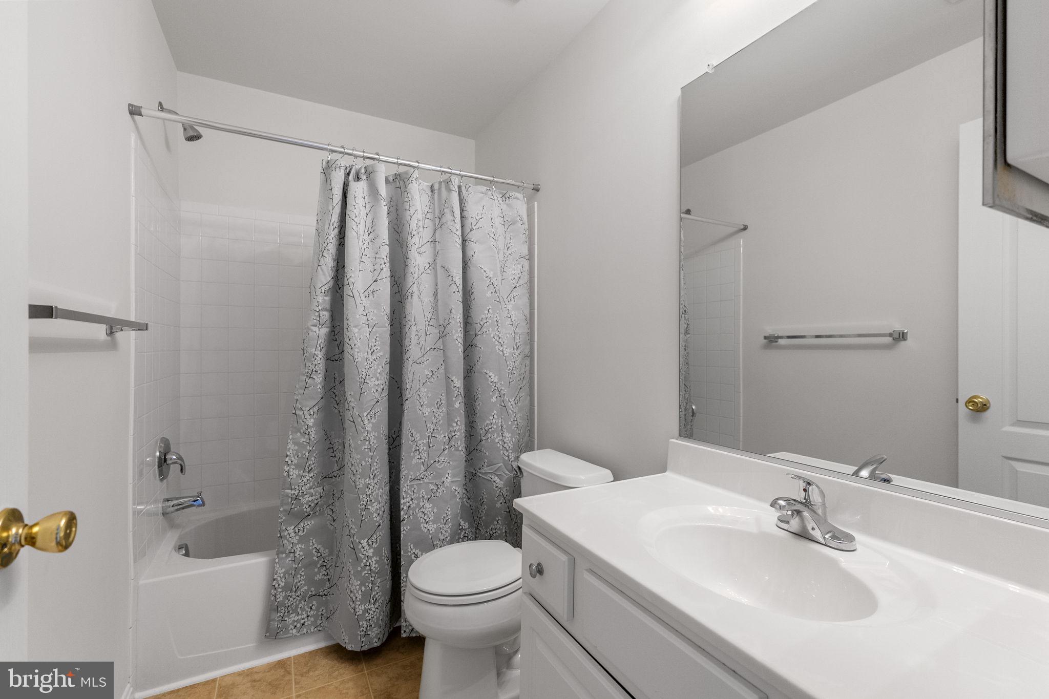 127 Mountain Creek Circle Frederick, MD 21702 - Photo 23 of 26 a bathroom with a sink toilet and shower
