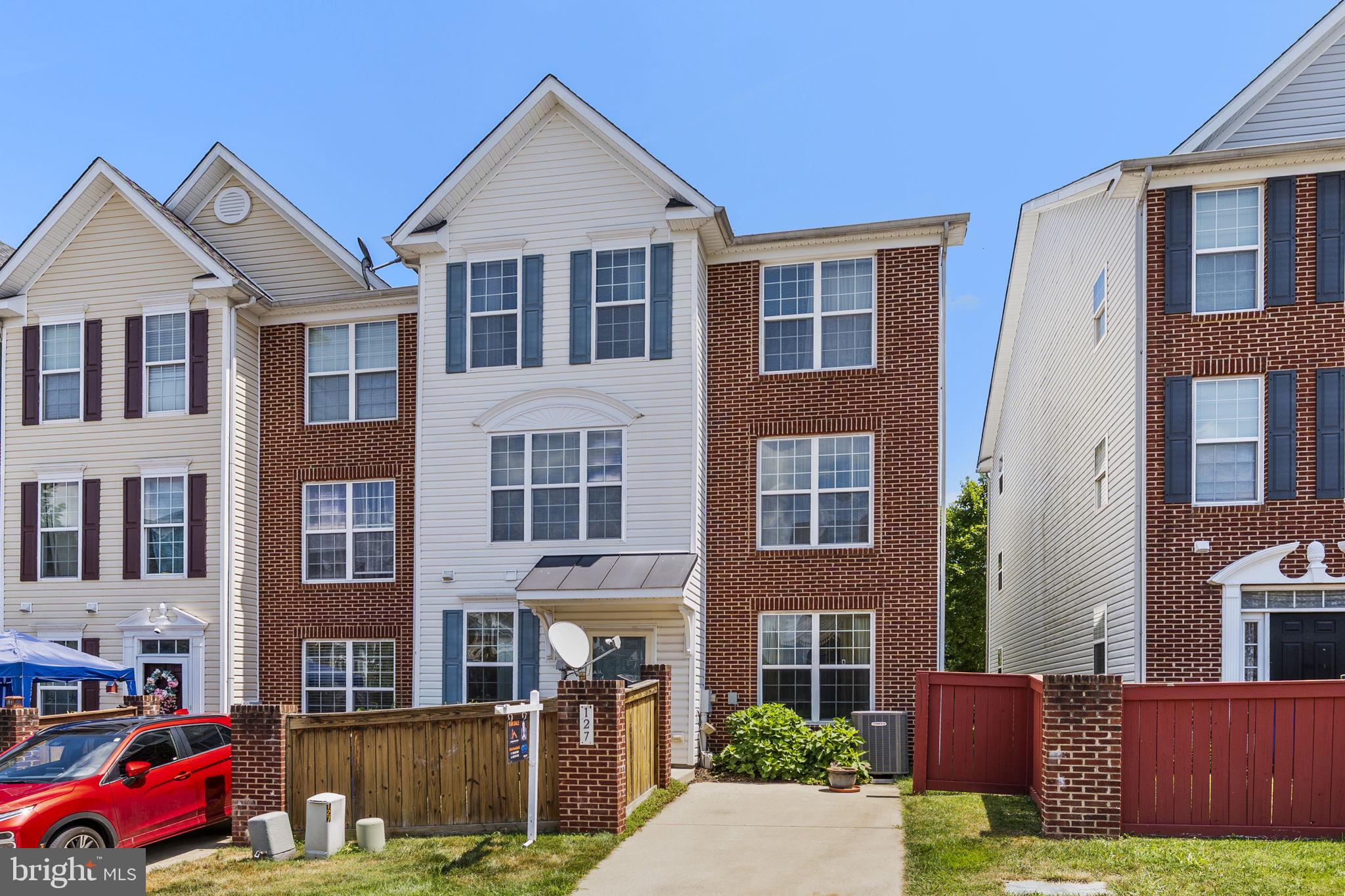 127 Mountain Creek Circle Frederick, MD 21702 - Photo 26 of 26 a front view of a residential apartment building with a yard