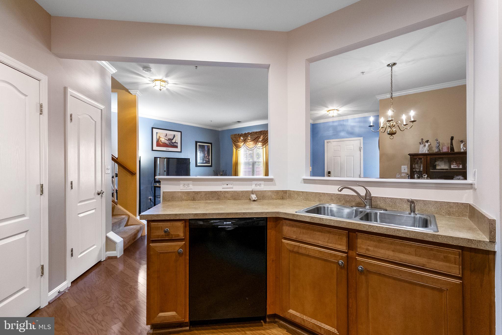 127 Mountain Creek Circle Frederick, MD 21702 - Photo 7 of 26 a kitchen with a sink and a refrigerator