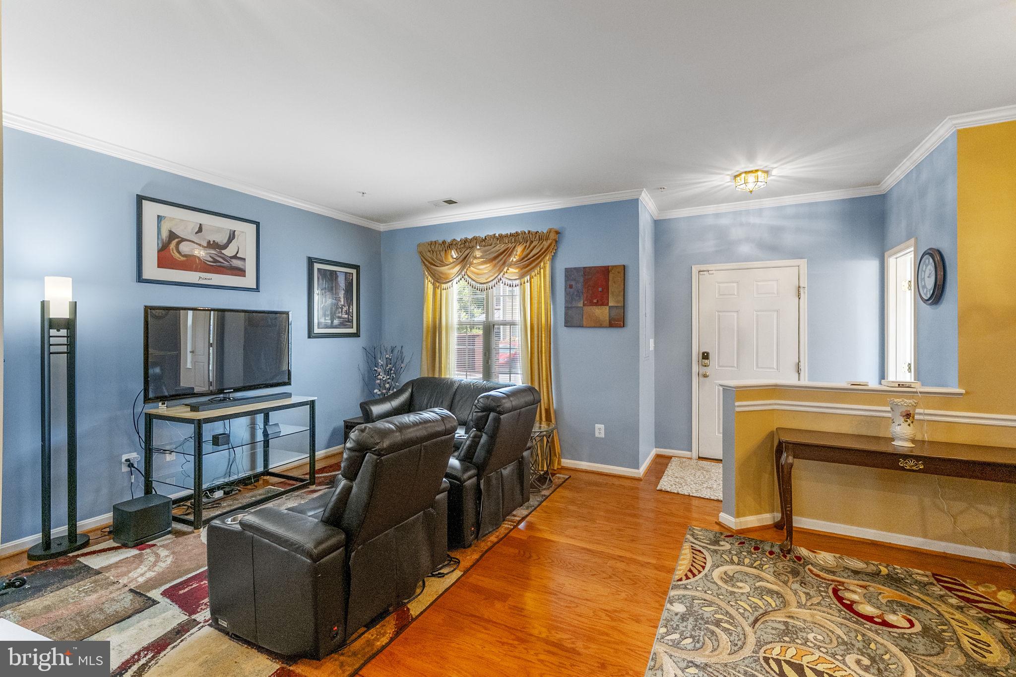 127 Mountain Creek Circle Frederick, MD 21702 - Photo 8 of 26 a living room with furniture and a flat screen tv